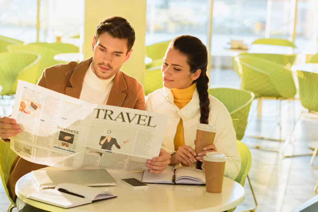 man and women looking at travel paper