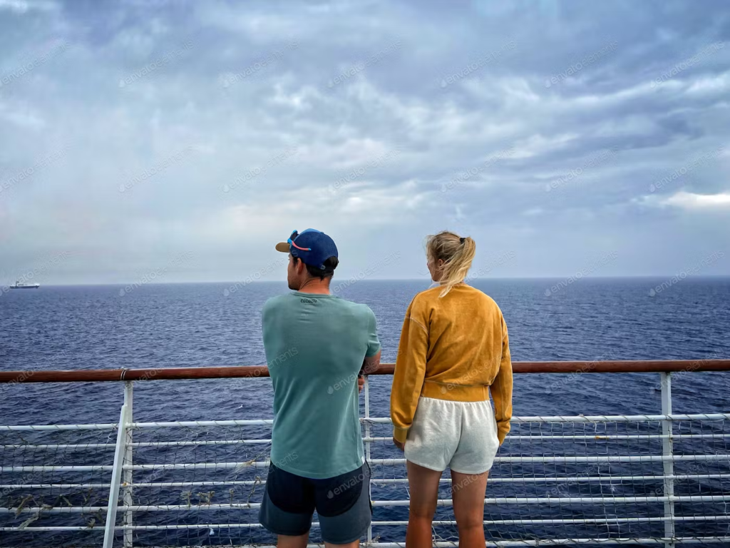 people watching off the balcony of the cruise ship
